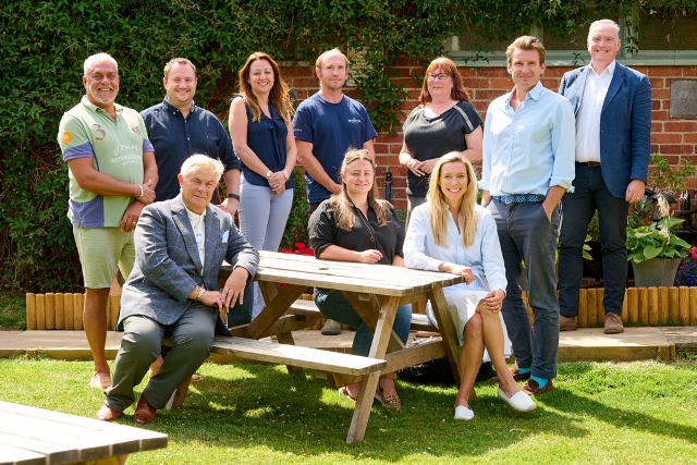 Members of the Brakspear’s Giving Back committee (apart from John Farrell of Chiltern Bee and Tom Davies, Brakspear chief executive).   Back row, l-r): Sean Arnett, tenant, The Blackwood Arms; Matt Godwin, Brakspear finance & systems analyst; Emma Sweet, Brakspear leased & tenanted marketing manager; John Farrell, Chiltern Bee and Brakspear beekeeper; Claire Sugg, tenant, The Hare & Hounds; Tom Davies, Brakspear chief executive and Gerard Winder, Brakspear business development manager   (front row, l-r); Pete Collie, tenant, The Horseshoe; Jacqueline Fletcher, marketing manager, Brakspear’s managed Honeycomb Houses; Alexa Davies, chairperson of Brakspear’s Giving Back